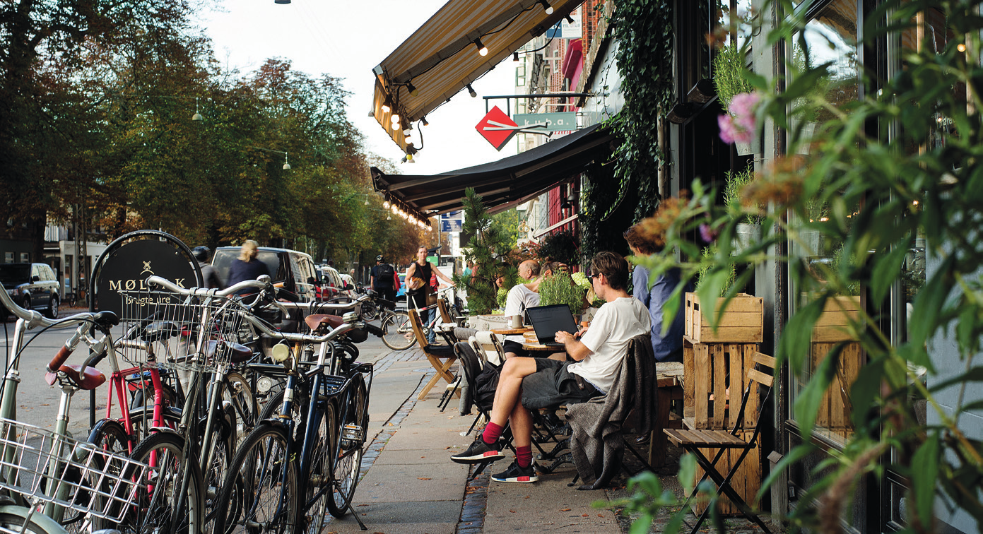 Østerbro street scene with café and urban life.