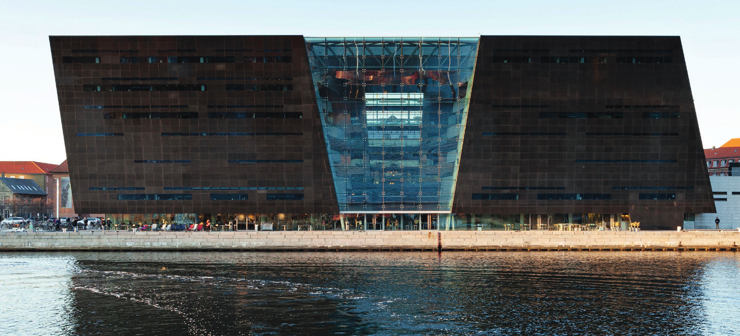 Modern facade of The Black Diamond library in Copenhagen, with black granite and glass architecture.