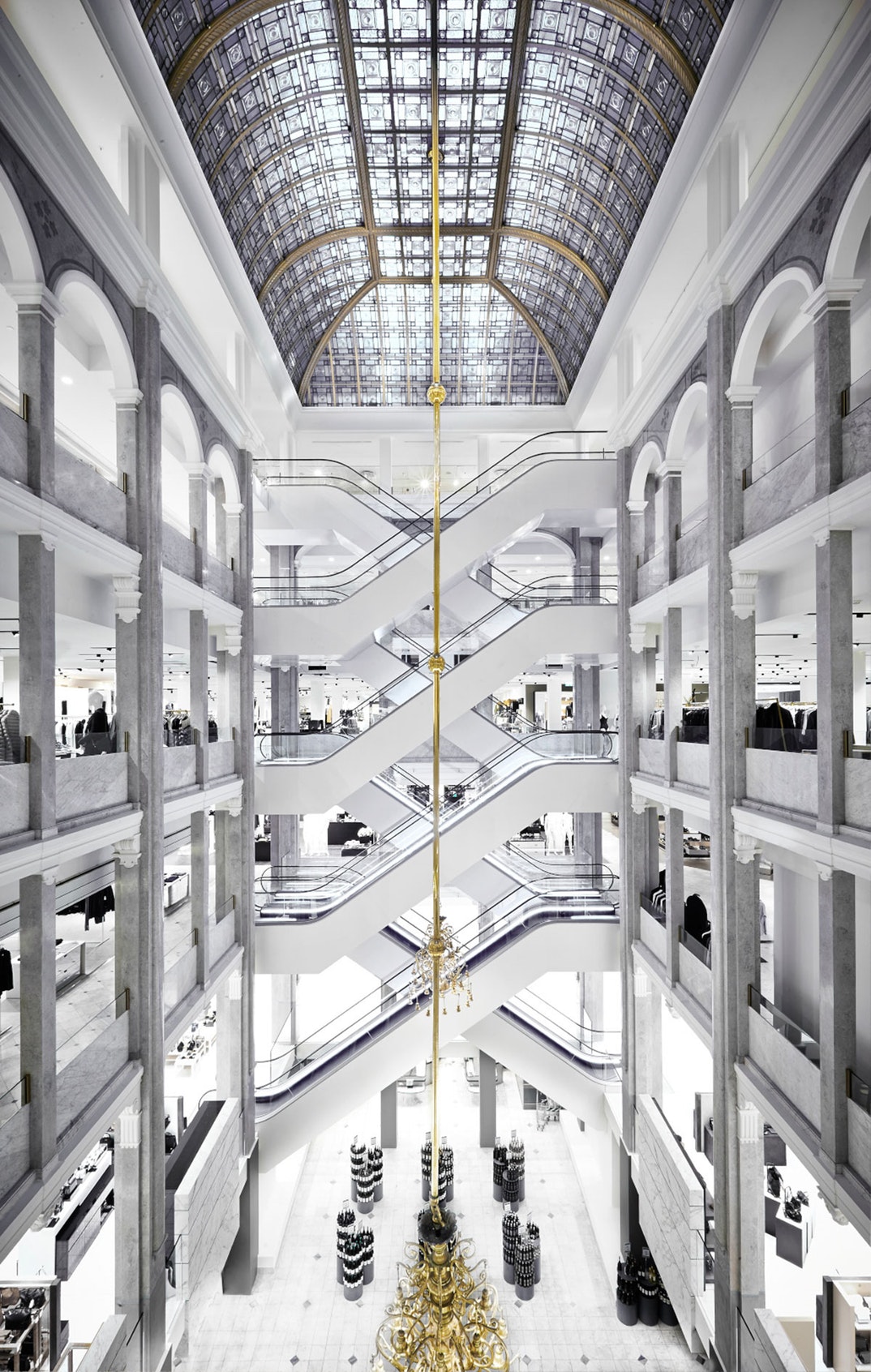 Interior view of ILLUM department store in Copenhagen, showing multiple floors and luxury displays.