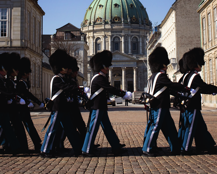 Royal guards performing the daily changing ceremony at Amalienborg Palace in Copenhagen.