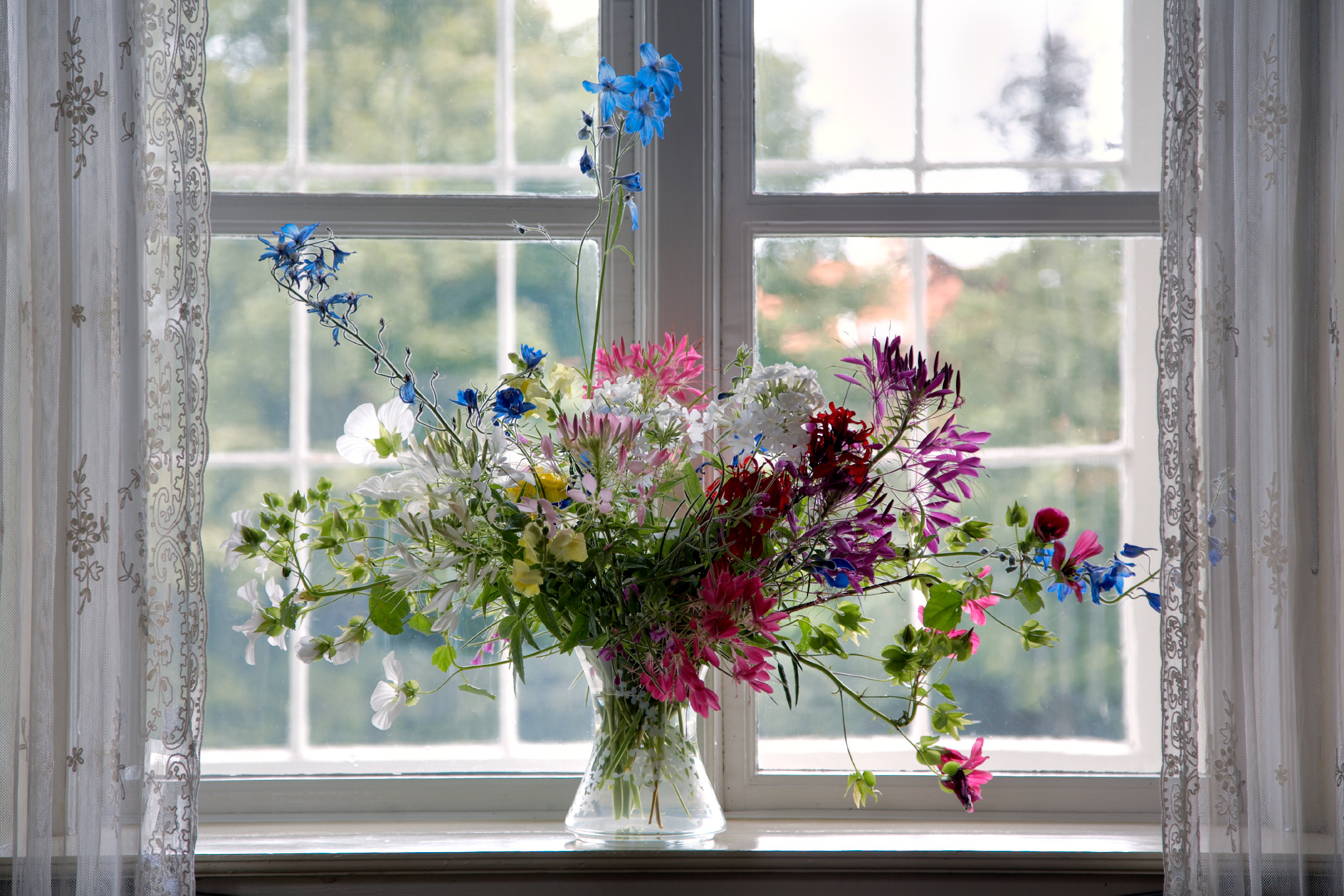 Decorative flower vase on a sunlit windowsill at Rungstedlund.