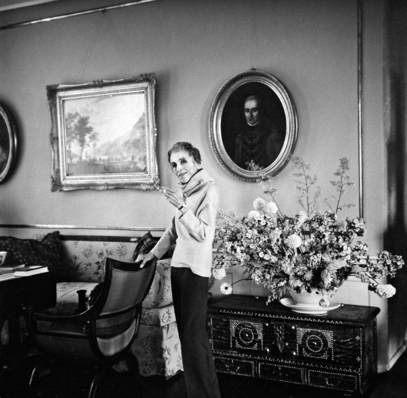 Black and white photo of Karen Blixen in her historic home at Rungstedlund.